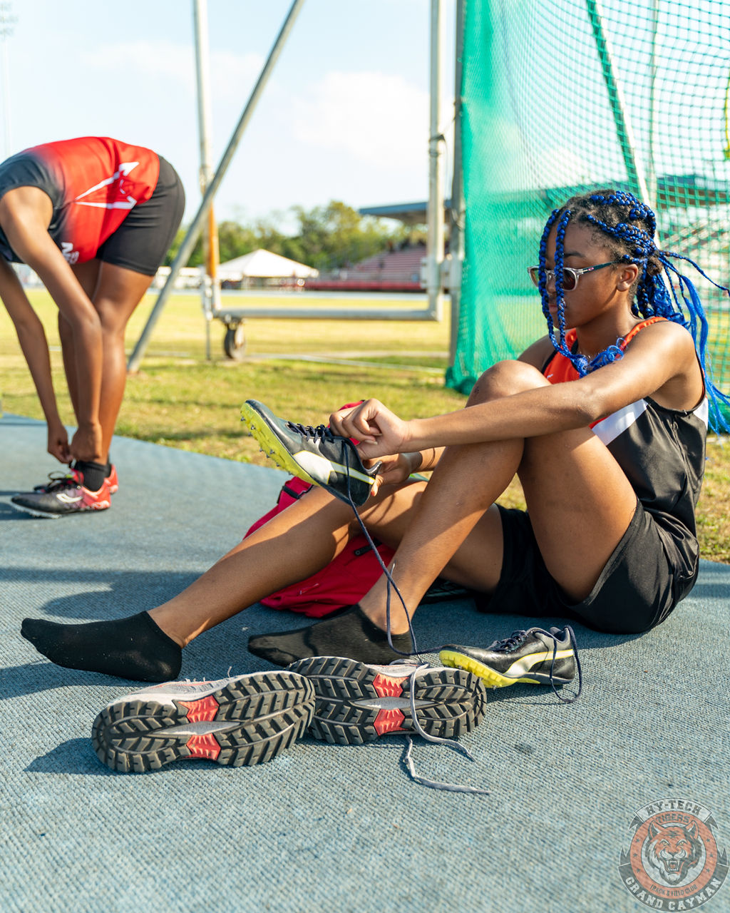 Girl putting on shoes